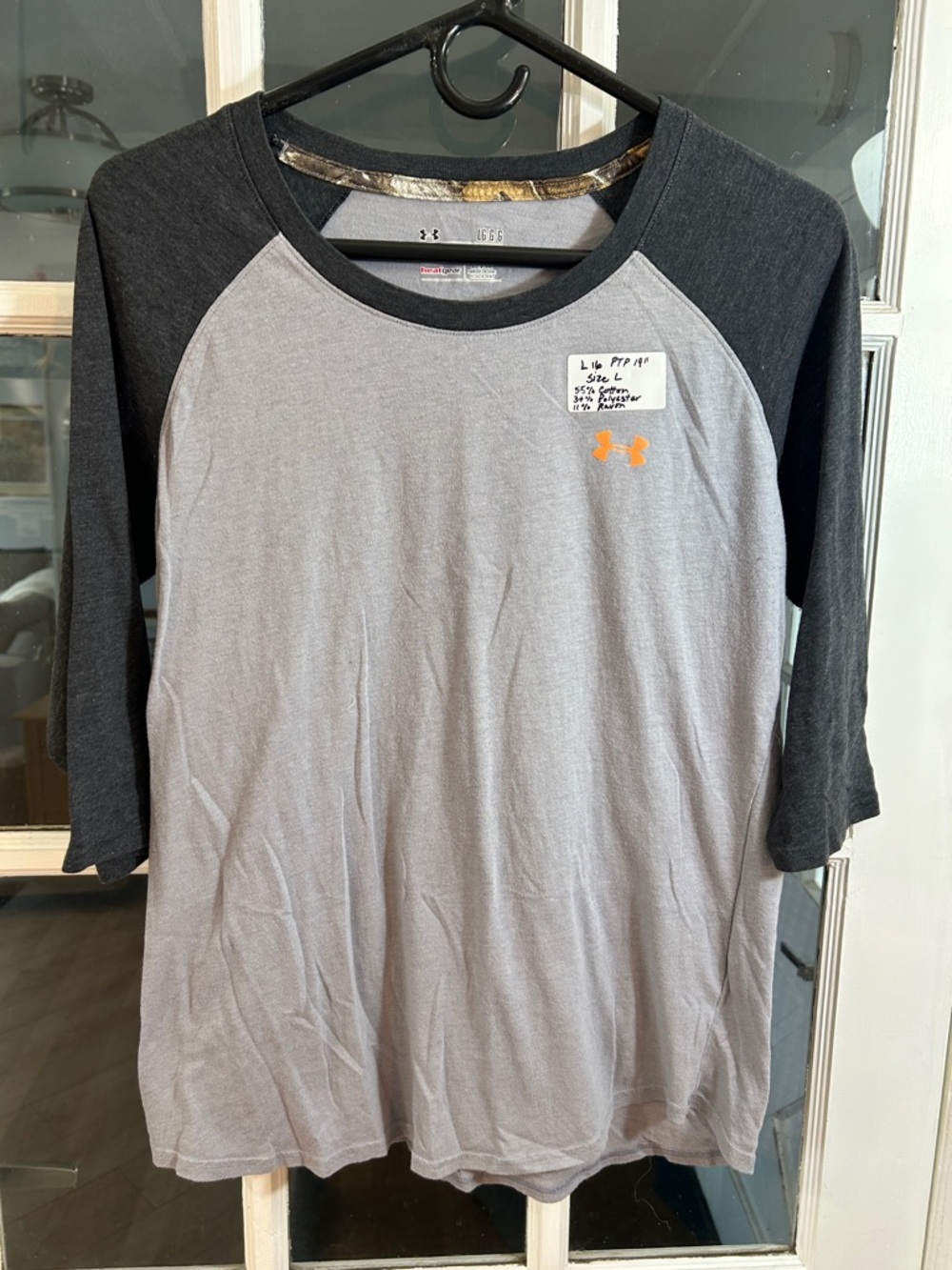 L16.    Under Armour gray & Black Raglan Baseball Tee